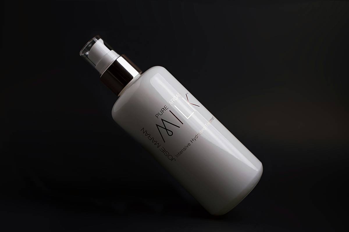 Woman applying body wash shower gel for women with soft, hydrated skin